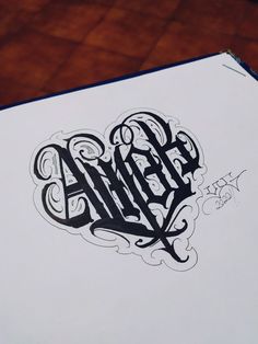 an inked piece of paper with the word hello written in black and white on it