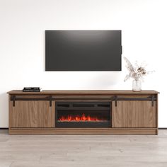 an entertainment center with a fireplace in the middle and a flat screen tv above it