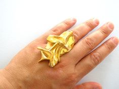 One of a kind handmade Gold Plated Shiny Folding Ring! Gold Plated Shiny Folding Ring is made with the ancient lost wax method. I make the Gold Plated Shiny Folding Ring in wax and then it is casted either in bronze and then gold plated No two rings will be exactly the same as they are completely handmade one by one. This listing is for the ring you see in the picture B A C K to my shop >> www.etsy.com/shop/StoixeioJewelry Made this way to fit every size. Just tell me your size and i will Artistic Metal Ring Jewelry For Gifts, Unique Rings With Lost Wax Casting As Gift, Handmade Artsy Rings As Gifts, Handmade Artsy Rings For Gift, Artistic Hand Forged Rings As Gift, Unique Bronze Rings For Gifts, Unique Bronze Rings For Gift, Artistic Hand Forged Rings For Gifts, Artisan Brass Rings As Gifts