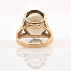 Exquisite 14 karat solid yellow gold ring set to the front with one large oval-cut smoky quartz measuring approximately 18 millimeters long by 13 millimeters wide and weighing an estimated 10.56 carats. The ring is a size 6 1/2 and can be re-sized to fit by your local jeweler. It is stamped 14K and signed AJ. It weighs approximately 6.23 grams. Excellent estate condition. We are listing several pieces of estate jewelry, along with other items fresh from fine North Carolina estates. We are happy Gemstone Rings Vintage, Smoky Quartz Ring, Gold Ring Sets, Diamond Cluster Ring, Quartz Ring, Diamond Cluster, Ring Vintage, Smoky Quartz, Solid Yellow