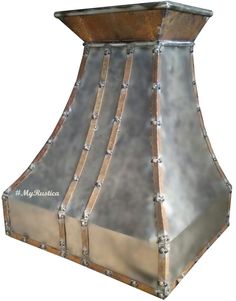 a large metal hood with rivets on it