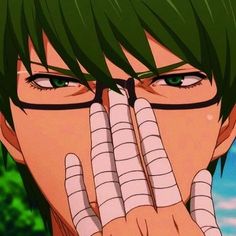 an anime character with green hair and glasses covering his face while looking at the camera