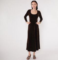 Vintage 90s dress in brown velvet. It has long sleeves with an empire waist and a draped ankle length skirt. Please see measurements and condition below. Every garment we sell is authentic vintage and one-of-a-kind! You will receive the exact item photographed. Condition: Very good vintage with light general wear. Size label: Labelled Medium Tag: B.C.B.G. Petites Material: 76 Polyester 16 Nylon 8 lycra Era: late 90s/y2k MEASUREMENTS Taken from seam to seam while the garment is lying flat. Double the armpit, waist, and hips For reference, model is 5'7" and measures 31-24-34. Length from Top: 49" Armpit to Armpit: 16 to 19" Waist: 13 to 16" Hips: 21" Shoulder to Shoulder: 15" Sleeve: 21" For sales and promotions, follow us @Shopexile *219901327* Velvet Dress 90s, Brown Velvet Dress, Vintage 90s Dress, Ankle Length Skirt, Brown Velvet, 90s Dress, Late 90s, Size Label, Vintage Brown