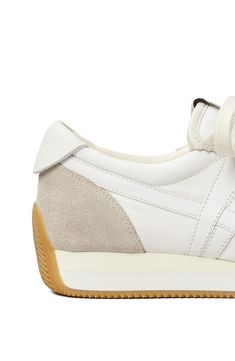 This lace-up sneaker with a padded collar features a retro-inspired silhouette and neutral color blocking. Lace-up style Leather and textile upper and lining/rubber sole Imported Women's Shoes White Beige, Neutral Color, Up Styles, Retro Inspired, Neutral Colors, Puma Sneaker, Women's Shoes, Womens Sneakers, Color Blocking