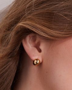 Made in 18K gold over brass Orb diameter: 11 mm Luxury Elegant Orb Earrings, Gold Orb Earrings, Modern Polished Sphere Earrings, Elegant Gold-tone Brass Huggie Earrings, Gold Single Sphere-shaped Earring, Stethoscope Charms, Pill Bottles, Healthcare Workers, Conscious Consumer