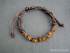 "Tiger Eye bracelet, a braided brown cuff or stacking wristband with protection stones. A perfect gift for him or her, or for that special one that loves yoga and natural stones. The bracelet is braided on 2mm brown satin cord with adjustable knot finish. Due to the adjustable sliding knot finish, it can fit perfect to everyone. Check below the dimensions and cord length. If you want bigger size bracelet please contact me. The listing is for one bracelet similar to the bracelet shown in photos w Brown Braided Bangle Bracelets As Gift, Adjustable Braided Bangle Jewelry, Brown Braided Bangle Bracelet For Gift, Brown Braided Bracelet For Gifts, Adjustable Brown Leather Bracelet With Natural Stones, Adjustable Braided Bracelet Jewelry, Casual Braided Beaded Bracelets As Gift, Adjustable Braided Jewelry Bracelet, Casual Braided Beaded Bracelets For Gift