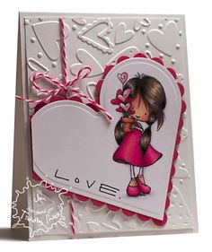 a card with a girl holding a heart