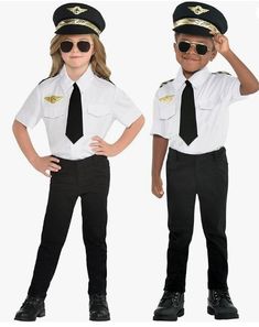 two children dressed in police uniforms and sunglasses