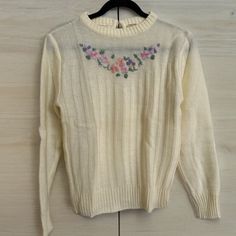 Beautiful vintage sweater in excellent vintage condition with no known flaws.  Size small, see pics for measurements. Front length is 21". Small button closure in the back.  IMPORTANT: My items are vintage. As with any pre-owned item, there will be varying degrees of wear - especially the older antique pieces. I do my best to point out any flaws, defects or wear issues, and supplement with pictures. To reduce wear and tear on vintage clothing, I do not usually wash items first. I leave the cleaning of these fun pieces to the new owner. I hope that I have done everything possible to make your buying experience a pleasure. If you receive something and notice that I have missed something or made a mistake, please contact me so I can quickly rectify any issues. I do not accept returns or excha Retro White Knit Sweater, White Retro Cotton Sweater, Retro Long Sleeve Cream Sweater, 60s Sweater Vest, 60s Sweater, 1960s Sweater, Embellished Sweater, Made A Mistake, Chandler Az