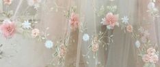 pink and white flowers on sheer fabric