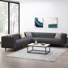 a living room with a blue couch and coffee table