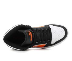 a black and white shoe with orange accents