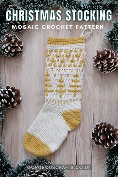 A white crochet Christmas Stocking decorated with mustard coloured toe and heel with a Christmas tree pattern, lying on a wooden background surrounded by pine cones Mosaic Crochet Christmas, Diy Stockings Pattern, Inset Mosaic Crochet, Crochet Stocking Pattern Free, Stocking Pattern Free, Christmas Mosaics, Holiday Crochet Patterns, Crochet Christmas Stocking Pattern, Crochet Bloggers