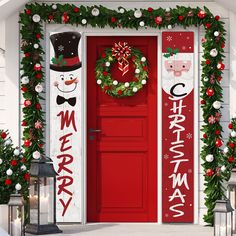 a red door decorated with christmas decorations and wreaths