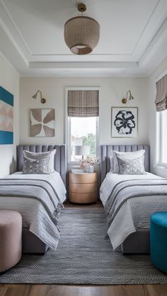 two beds sitting next to each other on top of a carpeted floor in a bedroom