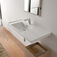 a bathroom sink sitting under a mirror next to a window