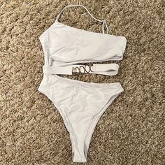 White Swimsuit With Gold Accents. Never Worn Trendy White One-piece Swimwear, Trendy White Lined Bodysuit, White Beachwear Bodysuit For Summer, White One-piece Summer Bodysuit, White Bodysuit For Beach Season Parties, White Party Bodysuit For Beach Season, Trendy White Lined Swimwear, White One-piece Swimwear For Spring, White Summer Party Swimwear