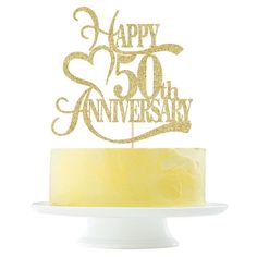 a 50th birthday cake topper with the number 50 on it and gold glitter lettering