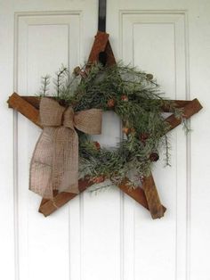 a wooden star with a wreath on it