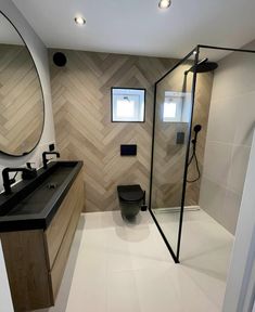 a bathroom with a shower, toilet and sink