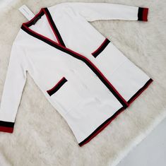 White, Warm Cardigan With Red And Black Stripes. New With Tags. Might Need A Delicate Cleaning. White V-neck Outerwear For Layering, Elegant White Oversized Cardigan, Trendy White Sweater For Layering, Chic White V-neck Sweater, Trendy White Cardigan For Work, Chic White Cardigan For Layering, Trendy Oversized White Cardigan, White Cardigan For Work In Fall, White Cardigan For Workwear In Fall