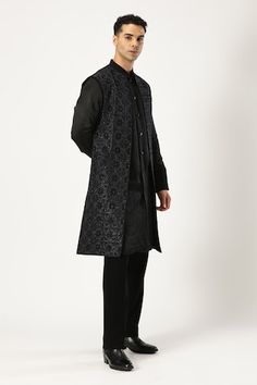 Black sherwani style kurta with statement buttons. Paired with a black trouser. - Aza Fashions Black Straight Kurta Bandhgala For Festive Season, Festive Black Straight Kurta Bandhgala, Black Long Sleeve Designer Bandhgala, Designer Black Sets For Winter, Designer Black Straight Kurta, Designer Black Kurta With Resham Embroidery, Designer Black Bandhgala For Festive Season, Designer Black Bandhgala For Festive Occasions, Designer Black Kurta For Formal Occasions