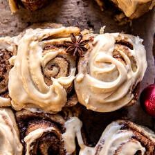 cinnamon rolls with icing and star anise on top