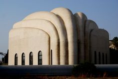 a large building with arched windows and arches on the side