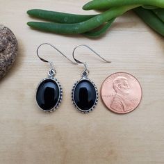 Visit our on-line shop at: Etsy.com/shop/AlbuqurqueDesigns *sterling silver earrings *dangles / drops / ear wires / hooks *southwestern jewelry *black onyx / black stone *calibrated pre-cut stones: big 14x10mm oval shape *all jewelry items are made to ship, slight variations in stones will occur comparing to pictures *size of a penny is 19mm or a dime is 18mm in diameter for comparing size with jewelry items *handcrafted in USA *free convenient gift box *free shipping in US, ship from US *seller Nickel-free Black Oval Jewelry, Black Oval Handmade Earrings, Elegant Black Oval Nickel-free Jewelry, Black Dangle Earrings, Black Earrings Dangle, Earrings Big, Jewelry Black, Southwestern Jewelry, Silver Dangle Earrings