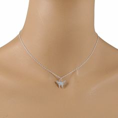 This beautiful crystal butterfly necklace is made with a dainty silver-plated crystal encrusted butterfly pendant and is suspended on a sterling silver chain with a sterling silver clasp. The necklace is available in five necklace lengths, please choose the necklace length you need from the drop-down menu. The necklace will arrive in an attractive gift box. Delicate Silver Butterfly Necklace With Clavicle Chain, Sterling Silver Crystal Necklace With Delicate Chain, Silver Cubic Zirconia Butterfly Necklace, Silver Sterling Crystal Necklace With Delicate Chain, Silver Sterling Butterfly Necklace With Clavicle Chain, Silver Delicate Butterfly Necklace, Silver Butterfly Necklace With Delicate Chain, Silver Delicate Butterfly Necklace With Delicate Chain, Silver Butterfly Pendant Necklace With Cubic Zirconia