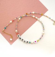 personalized letter necklace/letter bead necklace/beaded letter necklace/freshwaterpearl necklace/mix colour and pearl necklace/friendship******************************This delicate and colourful pearl necklace is a chic detail to your everyday style or as a gift to a loved one. Layer it up with more necklaces for a rich look or wear it alone for a clean and chic style. 🔸 CHOOSE YOUR LETTERSIf you want a different word, please write this in the message to seller box when you check out. If you w Trendy Everyday Pearl Necklace, Trendy Multicolor Pearl Necklace, Trendy Pearl Pendant Necklace, Trendy Multicolor Pearl Necklace For Gift, Trendy Multicolor Pearl Necklace Gift, Trendy Pearl Choker Necklace As Gift, Everyday Pink Necklaces With Letter Beads, Trendy Personalized Round Bead Necklace, Pastel Summer Jewelry Gift