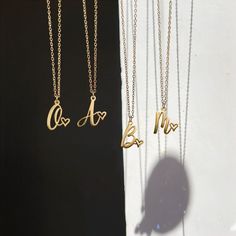 Personalize Your Style with Our Initial Necklace. Crafted with precision and attention to detail, this necklace is the perfect way to showcase your personal style. Metal: Stainless Steel Available in a variety of finishes: 🌹 Rose Gold 🟡 18k Gold 🥈 Silver The chain length options include: - 16" - 18" - 20" - 22" Each necklace is meticulously: ✨ Designed ✨ Polished ✨ Assembled Please note: All our items come with a 5 cm/2" extension chain. so don't hesitate about the size!! * 14" NECKLACE: Fits Valentine's Day Wedding Silver Initial Necklace, Gold Initial Necklace With Delicate Chain For Personalized Gift, Gold Initial Necklace For Anniversary On Mother's Day, Gold Personalized Initial Necklace For Mother's Day, Elegant Gold Name Necklace For Bridesmaid, Mother's Day Personalized Gold Initial Necklace, Initial Pendant Heart Necklace Gift, Gold Initial Necklace With Heart Charm For Personalized Gift, Personalized Gold Heart Pendant Initial Necklace