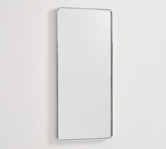 a mirror mounted to the side of a wall