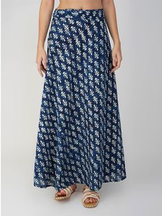 Indulge in the sheer comfort and beauty of our Veronica printed skirt tailored from the finest cotton fabric. Its wrap-around silhouette and free-size design make it easier for you to customize its A-line fit. Featuring a bright indigo canvas with white motifs, this versatile skirt is thoughtfully handcrafted with batik print. It is an Indonesian technique of wax-resist dyeing that involves the usage of beeswax and natural vegetable dyes. Having said that, with this contemporary and timeless pie Cotton Wrap Skirt With Gathered Detail, Blue A-line Cotton Bottoms, Cotton Flowy Wrap Skirt, Flowy Flared Cotton Maxi Skirt, Cotton Flared Maxi Skirt, Elegant Cotton Wrap Skirt With Lining, Cotton Flowy Maxi Skirt With Lined Skirt, Cotton A-line Maxi Skirt With Relaxed Fit, Cotton A-line Maxi Skirt With Gathered Detail