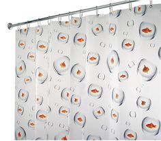 a shower curtain with goldfish and bubbles on it's side, in front of a white wall