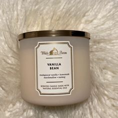 vanilla bean candle on white fur