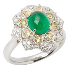 This ring designed by David Jerome is from his private collection and features one cabochon cut Emerald sourced in the chivor mine in Columbia. Totalling 2.16cts set with round brilliant cut Diamonds and yellow Sapphires totalling 0.32cts. Mounted in a platinum setting. Finger size UK N 1/2, EU size 54, USA size 6 1/2. David prides himself in only sourcing the finest and most exclusive gemstones whose natural beauty and colour enhance the settings he creates for each piece. These exclusive designs offer buyers a unique opportunity to own the kind of jewellery usually reserved for the finest and most exclusive brands in the world. A real legacy for the future. Contemporary Ring, Diamond Jewelry Designs, Royal Jewels, Pretty Rings, Yellow Sapphire, Emerald Diamond, High Jewelry, Round Brilliant Cut Diamond, Cluster Ring