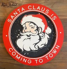 santa claus is coming to town sign on the wall