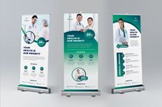 two roll up banners with doctors on them, one in green and the other in white