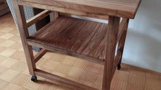 a wooden table sitting on top of a hard wood floor