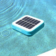 a solar powered device floating in the water near a swimming pool with an occupant attached to it