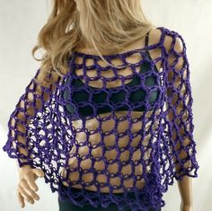 a mannequin wearing a purple crochet top