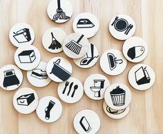 several buttons with different types of kitchen related items in them on a wooden table top