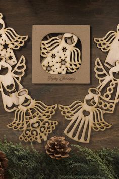 an image of christmas decorations on display with pine cones and fir tree branches in the foreground