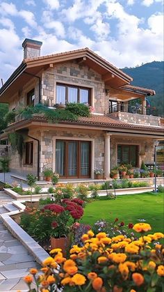 a house with flowers in the front yard