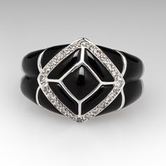 This beautiful ring features an inlayed design using calibré cut black onyx cabochons. The center of the ring is accented with a lozenge shape that is pavé set with twenty-four (24) round brilliant cut diamonds. The ring measures 15.1mm at the top, rises 6.9mm above the finger, tapering to 3.5mm wide and 1.4mm thick at the base of the shank. It is currently a size 6.5. Sizing will be limited due to the inlay, please call with inquiries. Classic Black Diamond Rings For Formal Occasions, Elegant Silver Enamel Ring For Formal Occasions, Elegant Oval Enamel Ring With Diamond, Modernist Diamond Ring For Formal Occasions, Elegant Enamel Ring With Polished Finish For Formal Occasions, Elegant Formal Enamel Ring With Single Cut Diamonds, Elegant Silver Enamel Ring For Formal Events, Classic Formal Enamel Ring With Gemstone, Elegant Formal Enamel Ring With Polished Finish