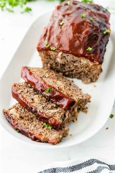 slices of meatloaf on a plate with ketchup