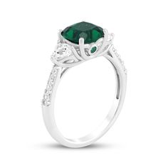 This glimmering lab-created emerald ring makes an unforgettable gift for your special occasion. Sterling silver A cushion-cut lab-created emerald is flanked by trillion-cut white lab-created sapphires Bezel-set round lab-created emeralds shimmer on the sides of the setting Round-cut white lab-created sapphires line the tapered shank Green Cushion Cut Diamond Ring For Formal Occasions, Gift Emerald Ring With Brilliant Cushion Cut, Gift Brilliant Cushion Cut Emerald Ring, Brilliant Cushion Cut Emerald Ring As Gift, Green Cushion Cut Ring For Gift, Green Cushion Cut Ring As Gift, Green Cushion Cut Emerald Ring With Accent Stones, Cushion Cut Emerald Green Rings, Green Cushion Cut Ring With Prong Setting