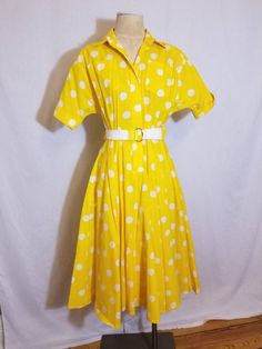 "++ THE NOTEBOOK DRESS ++ Amazing yellow and white polka dot dress Front button closure 2 front breast pockets and 2 hidden side pockets Full skirt Removable belt Made in USA Size 4 In excellent vintage condition ✂ - - - Measurements laid flat: Pit to pit: 18\" Waist: 13\" Hips: 24\" Top to bottom: 44\" Let's be friends! https://www.facebook.com/TheGirlSaidYesVintage" Vintage Polka Dot Dress With Short Sleeves For Summer, Yellow Vintage Short Sleeve Dress For Spring, Yellow Short Sleeve Vintage Dress For Spring, Retro Polka Dot Dress For Daywear, Yellow Knee-length Vintage Summer Dress, Knee-length Yellow Vintage Summer Dress, Yellow Knee-length Vintage Dress For Summer, Knee-length Yellow Vintage Dress For Summer, Retro Polka Dot Day Dresses