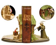 the lord of the rings figurine is in front of an open book case